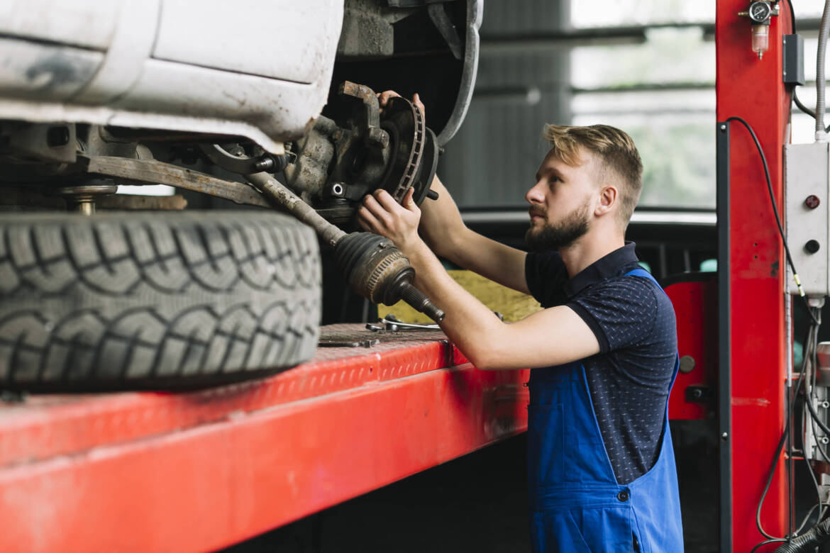 mechanic-fixing-wheel-mechanism-scaled.jpg